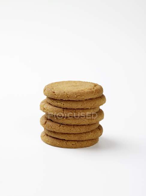 Biscuits stacked on white — Stock Photo