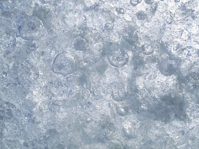 Closeup full-frame view of ice surface with frozen air bubbles — Stock Photo