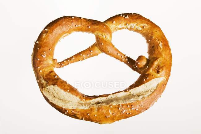 Salted pretzel on white background — Stock Photo