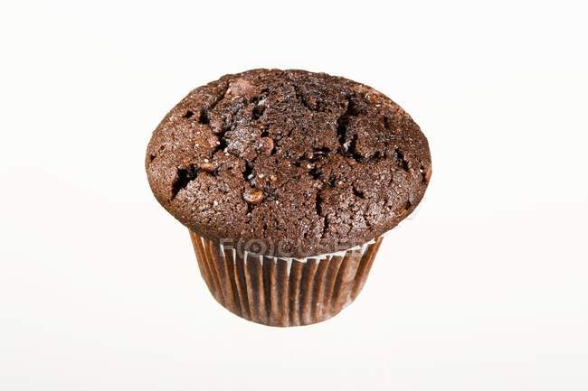 Chocolate muffin in paper case — Stock Photo