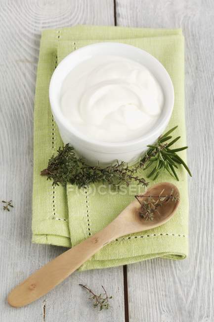 Elevated view of Creme Fraiche with rosemary and thyme — Stock Photo