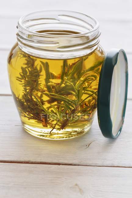 Olive oil with rosemary — Stock Photo