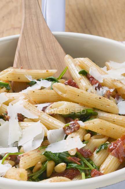 Penne pasta with dried tomatoes — Stock Photo
