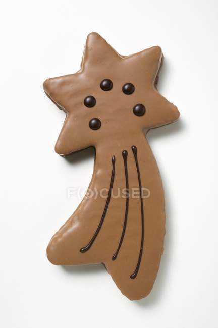 Shooting star biscuit with chocolate icing — Stock Photo