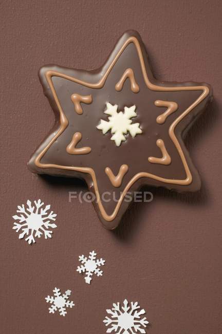 Star-shaped biscuit with chocolate icing — Stock Photo