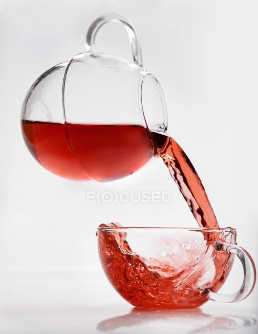 Pouring fruit tea — Stock Photo