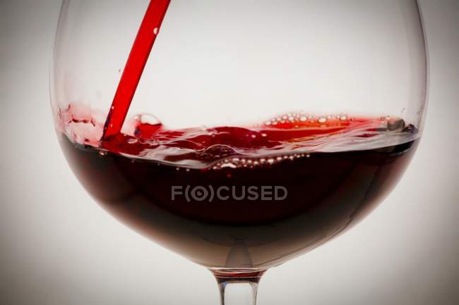 Red Wine Pouring into Glass — Stock Photo