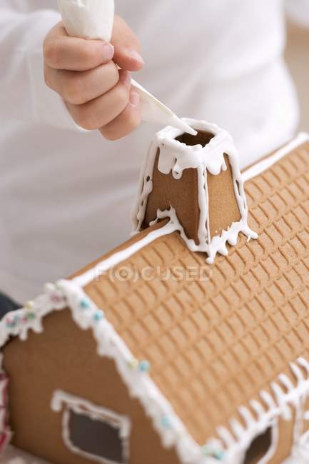 Child with piping bag — Stock Photo