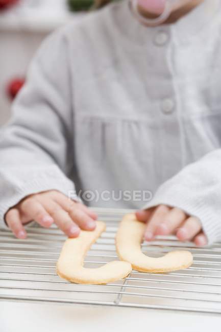 Child reaching for candy — Stock Photo