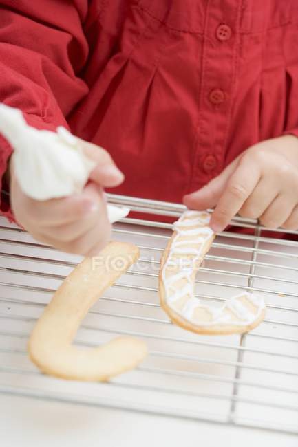 Girl with piping bag — Stock Photo