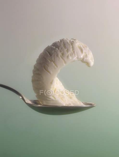 Lemon ice cream on spoon — Stock Photo