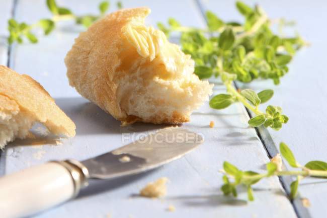 Bread spread with butter — Stock Photo