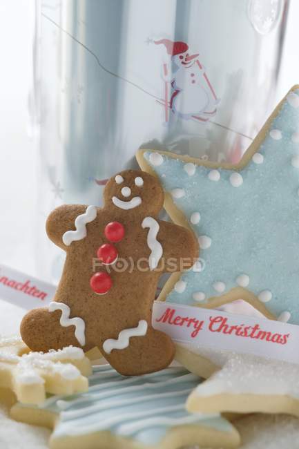 Biscuits with ribbon on white — Stock Photo