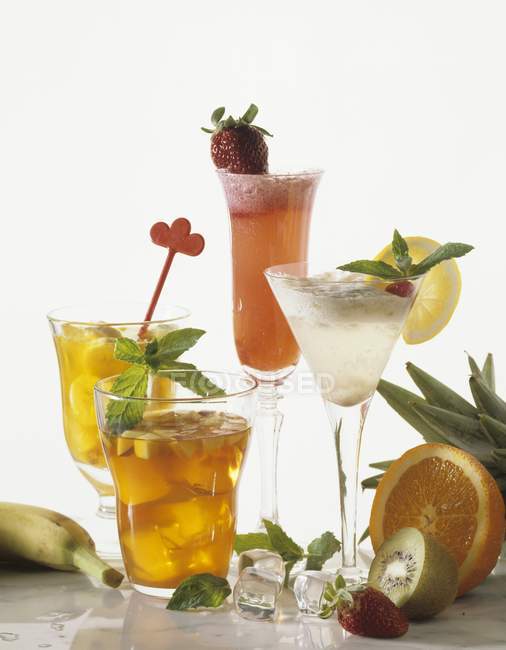 Various drinks with fruits — Stock Photo