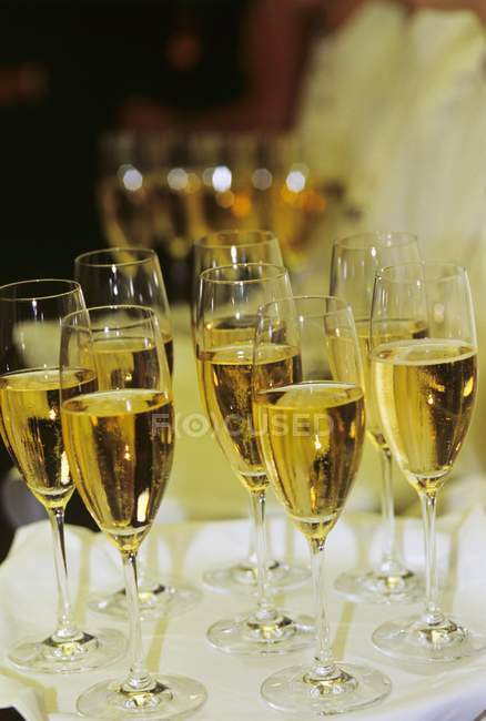 Sparkling wine in elegant glasses — Stock Photo