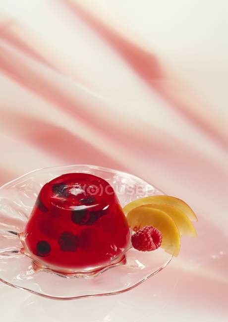 Berries in jelly on glass — Stock Photo