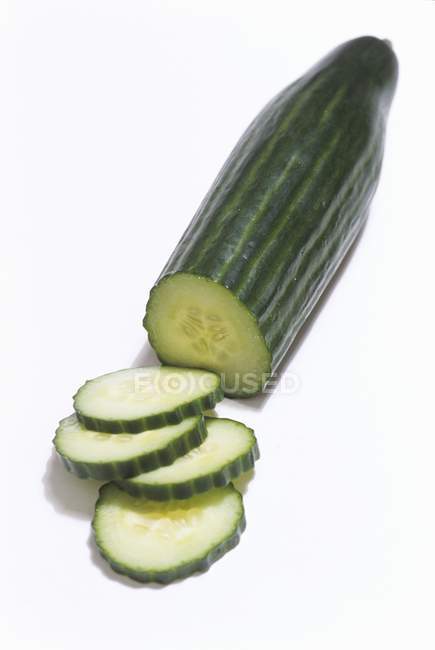 Cucumber partly sliced — Stock Photo