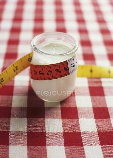 Jar of yoghurt with tape — Stock Photo