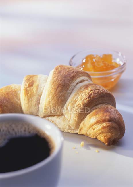 Fresh croissant with marmalade — Stock Photo