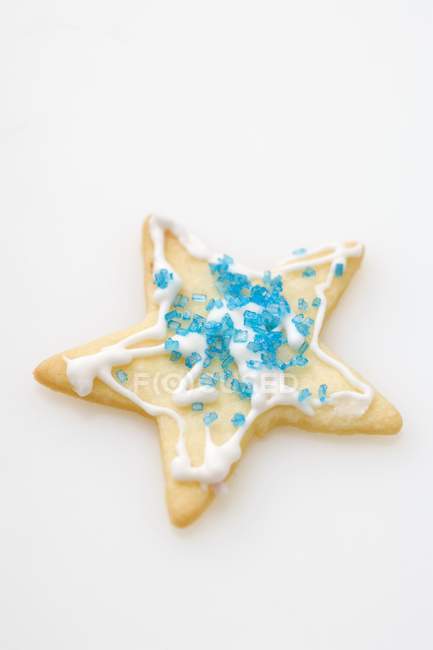 Biscuit decorated with blue sugar — Stock Photo