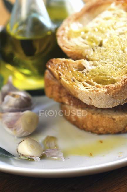 Bruschetta topped with oil — Stock Photo