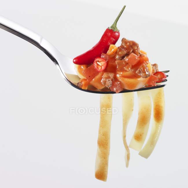 Tagliatelle pasta with tomato and chilli — Stock Photo