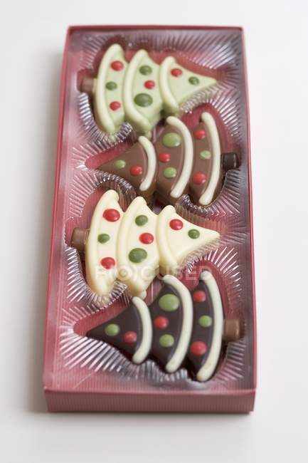 Chocolate Christmas trees in packaging — Stock Photo