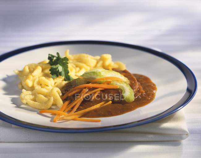 Braised beef with spaetzle — Stock Photo