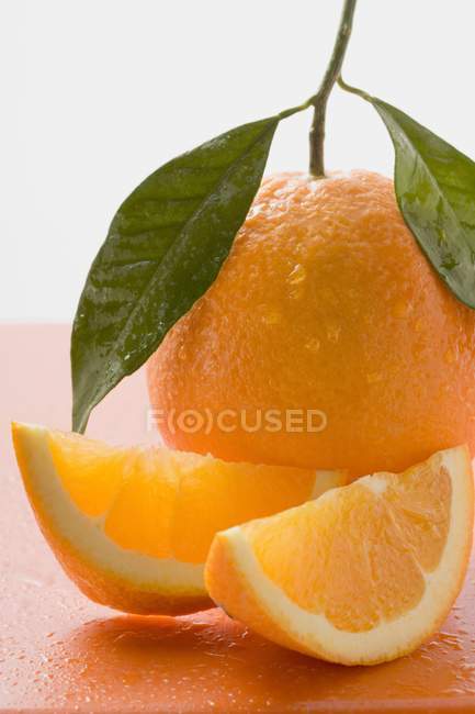 Orange with stalk and leaves — Stock Photo