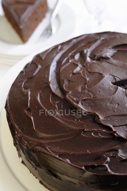 Chocolate cake topped with ganache — Stock Photo