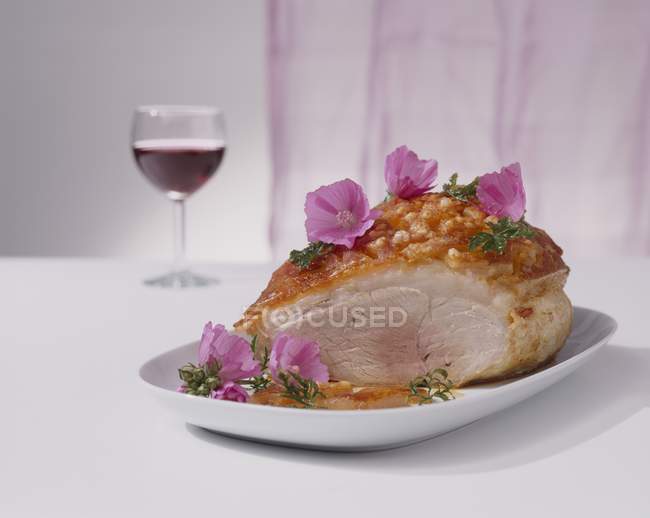 Partly carved Roasted pork — Stock Photo