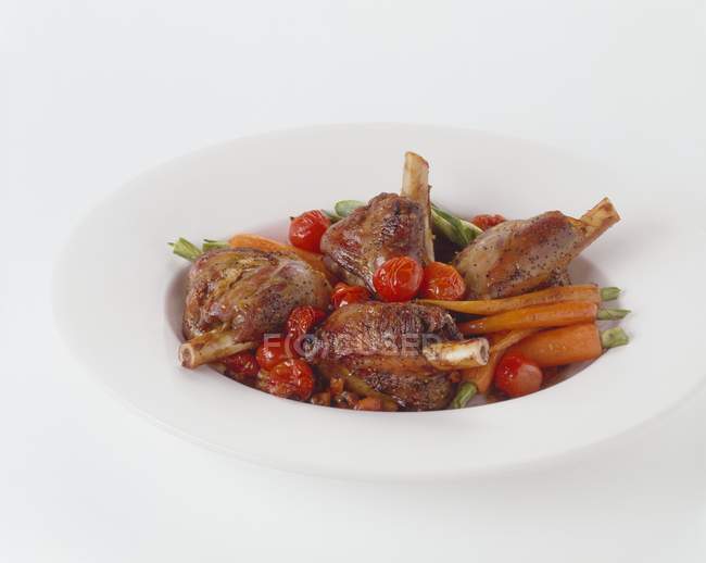 Braised lamb shanks with vegetables — Stock Photo