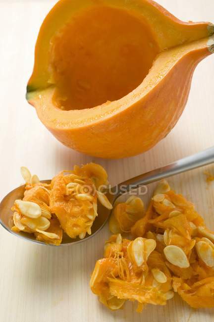 Hollowing out Hokkaido pumpkin — Stock Photo