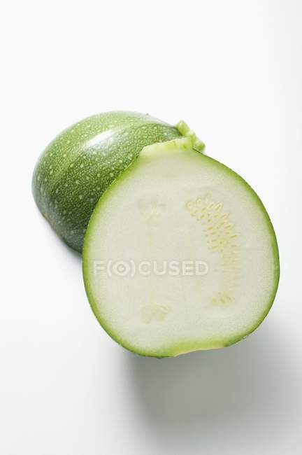 Fresh halved round courgette — Stock Photo