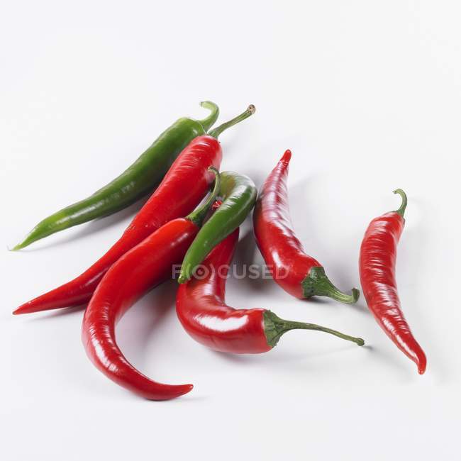 Several red and green chillies — Stock Photo