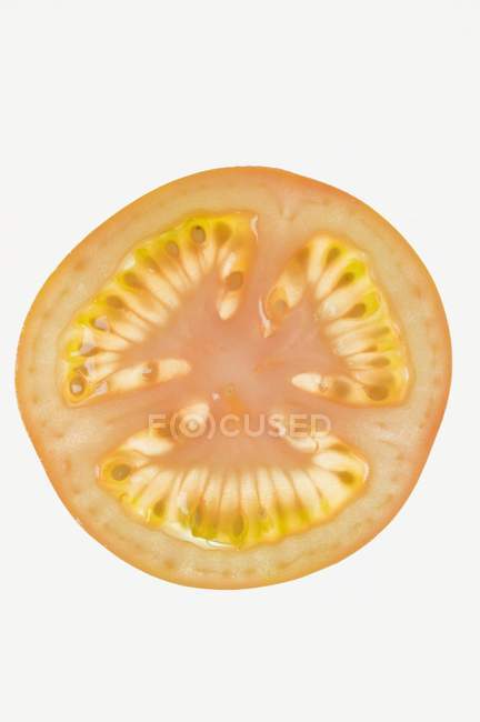 Кусочек красного помидора — стоковое фото