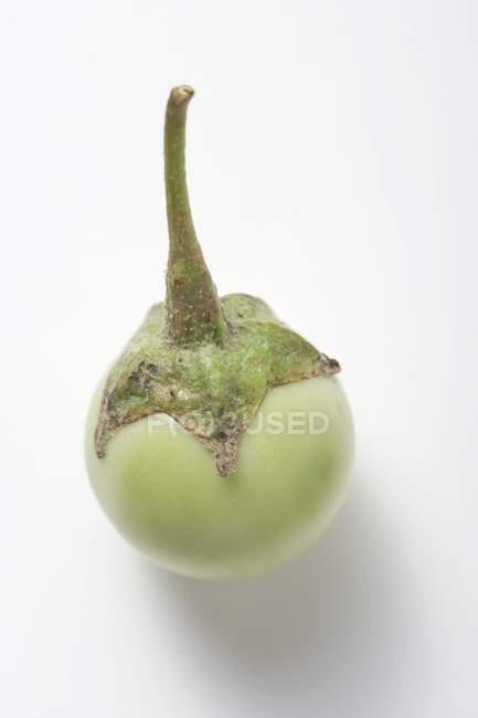 Green mini-aubergine with drops of water — Stock Photo