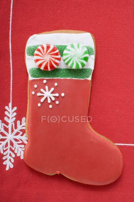 Boot-shaped biscuit decorated with peppermints — Stock Photo
