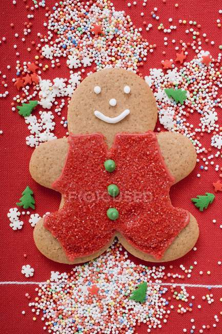 Gingerbread man on red — Stock Photo