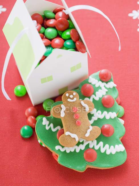 Christmas biscuits and paper — Stock Photo