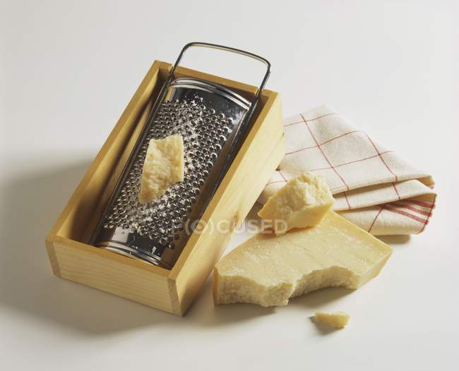 Parmesan cheese with grater — Stock Photo
