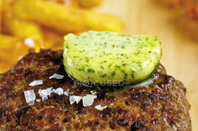 Herb butter on burger — Stock Photo