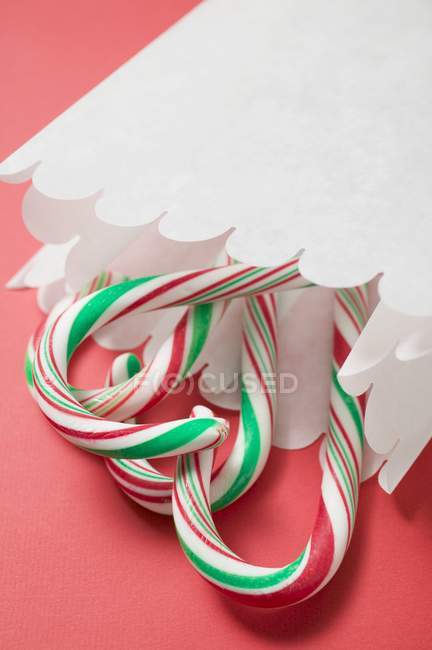 Candy canes in paper bag — Stock Photo