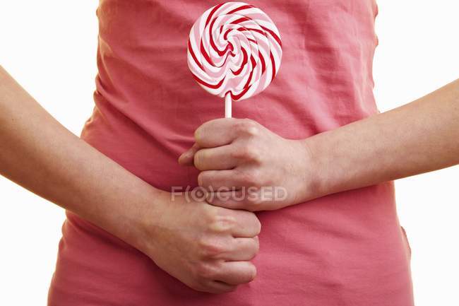 Woman holding lollipop — Stock Photo
