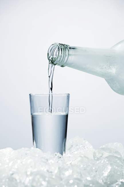 Pouring vodka into glass — Stock Photo