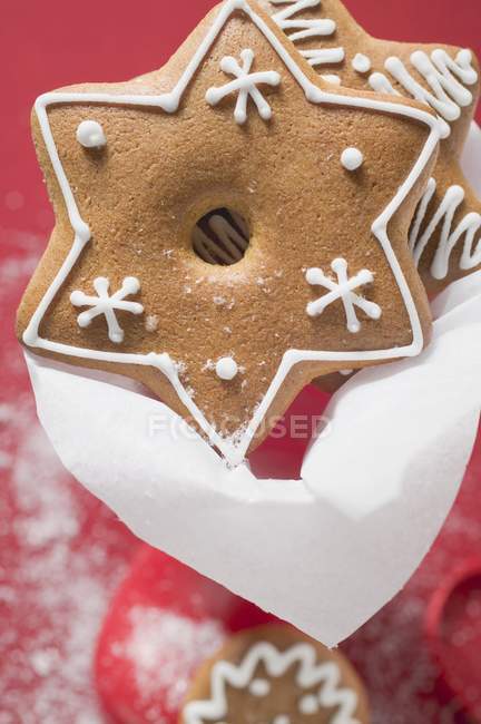 Assorted gingerbread on red background — Stock Photo