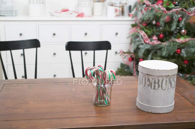 Candy canes & cookie tin — Stock Photo