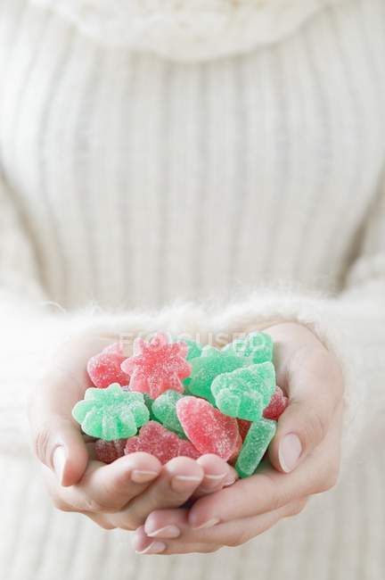 Woman holding jelly sweets — Stock Photo