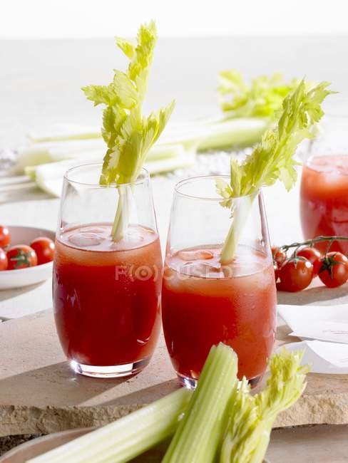Bloody Mary with celery in glasses — Stock Photo
