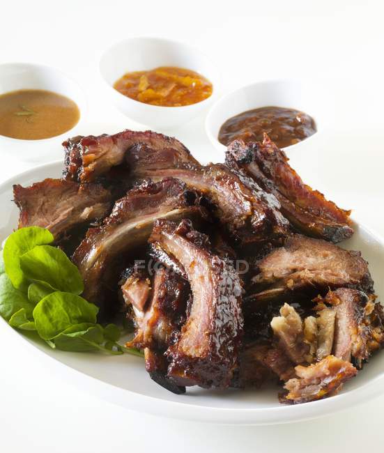 Barbecue Pork Ribs with Dipping Sauces — Stock Photo